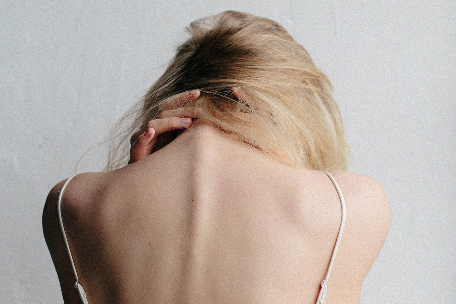 Woman holding her spine
